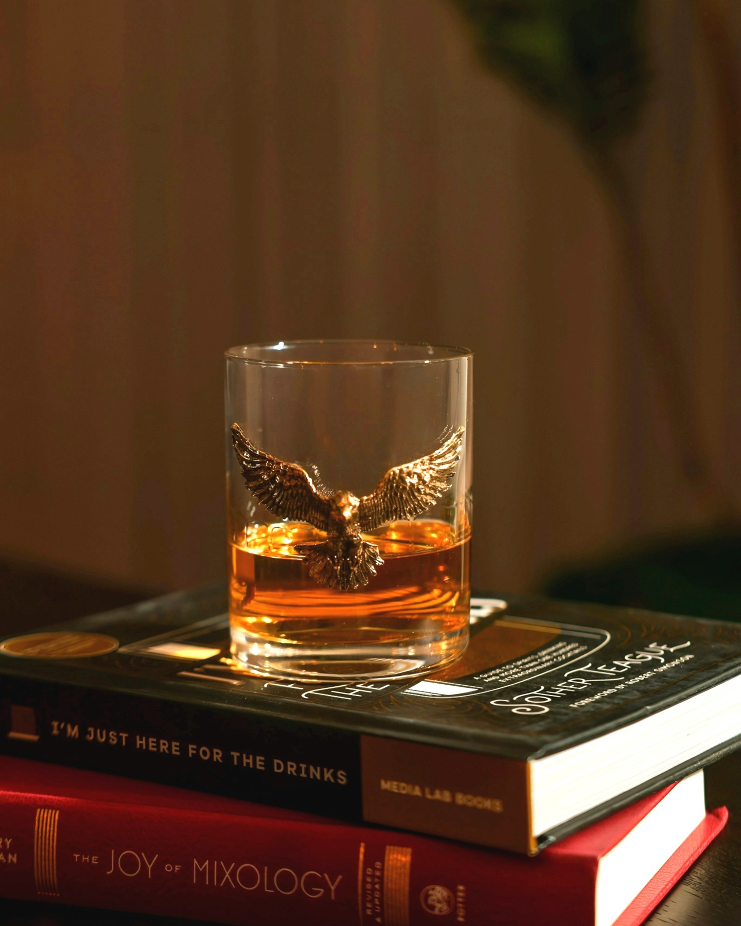 Instagram post with the caption: Here’s to freedom, eagles, and a good pour 🥃🦅
Nothing says sum...